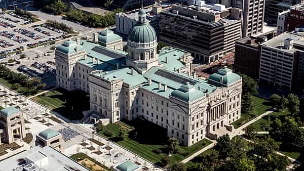 An aerial view of Indianapolis, Indiana, with the Indiana State House standing among the surrounding blocks