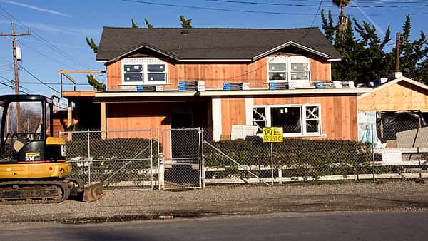 The old T. Hayer real estate office, a small storefront building seen from the street outside