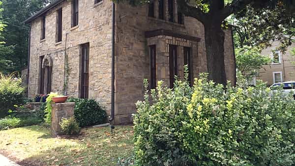 A stone house on Person Street in downtown Raleigh, North Carolina, unusual among its brick neighbors