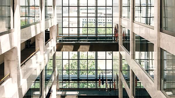 Flags hanging in the atrium of the Hart Senate Office Building in Washington, D.C., above an open floor