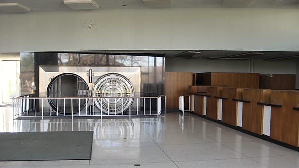 The interior of a bank vault in downtown Los Altos, California, its door standing open onto the deposit boxes