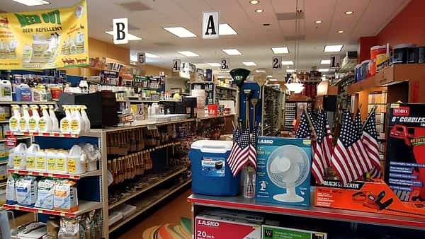 The interior of a hardware store in Berkeley Heights, New Jersey, looking down an aisle of stocked shelving