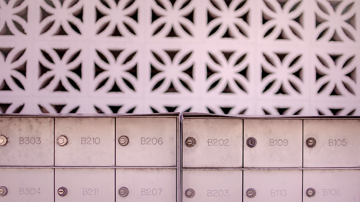 A bank of numbered mailboxes in Ocean City, United States, each with its own lock and letter slot
