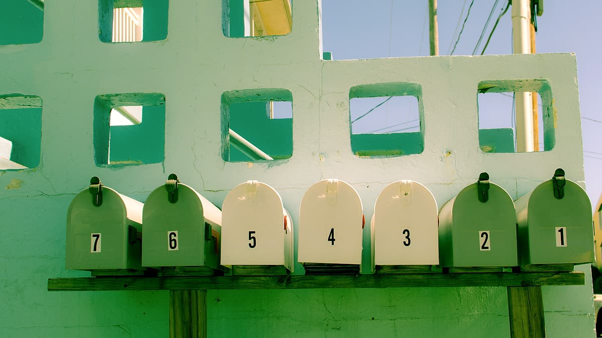 A wall of numbered mailboxes on 45th Street in Ocean City, United States, each with its own small door